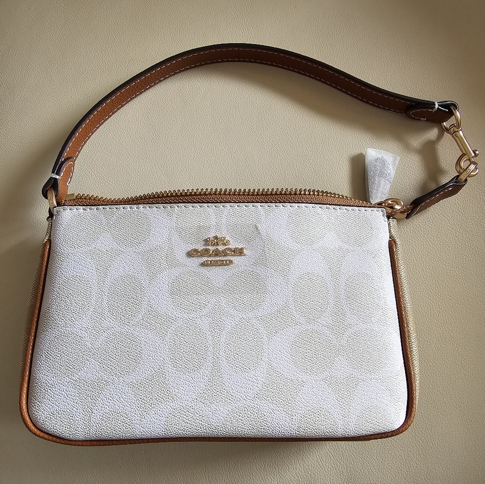 COACH NOLITA 19 IN BLOCKED SIGNATURE CANVAS